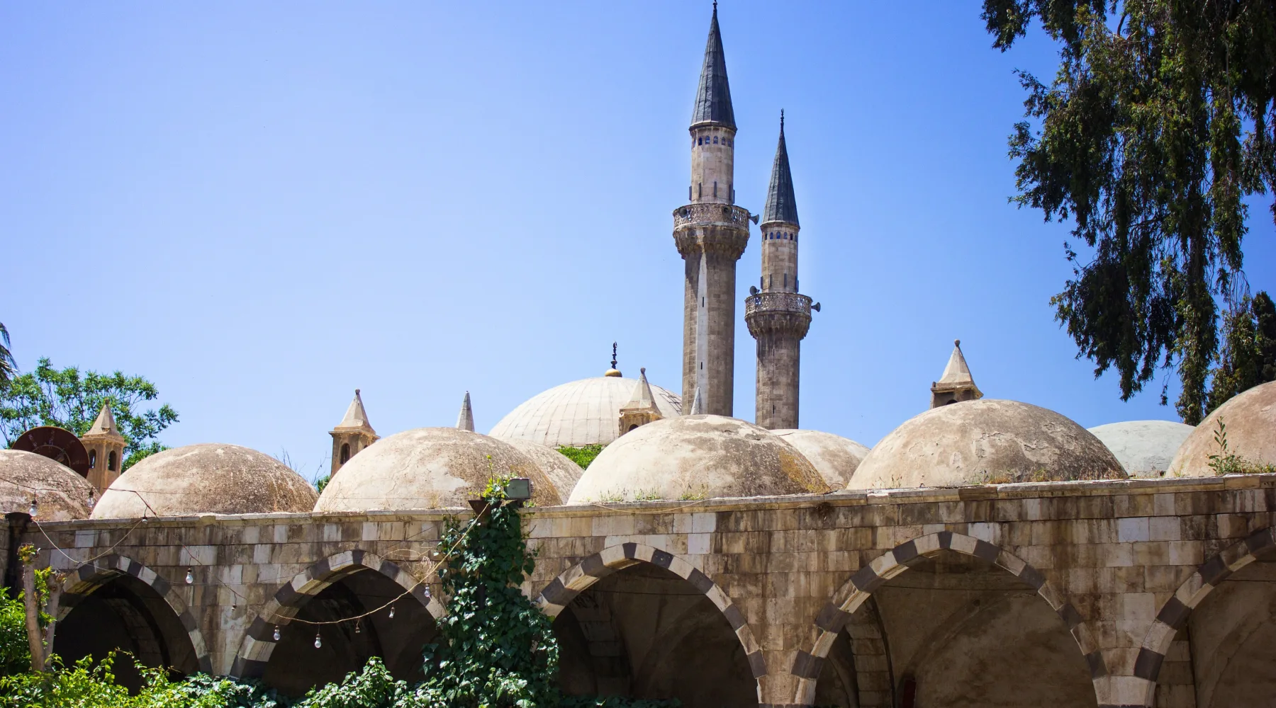 The lead domes and pencil minarets of the Takiyya al-Sulaimaniyya in Damascus, built to plans by Sinan
